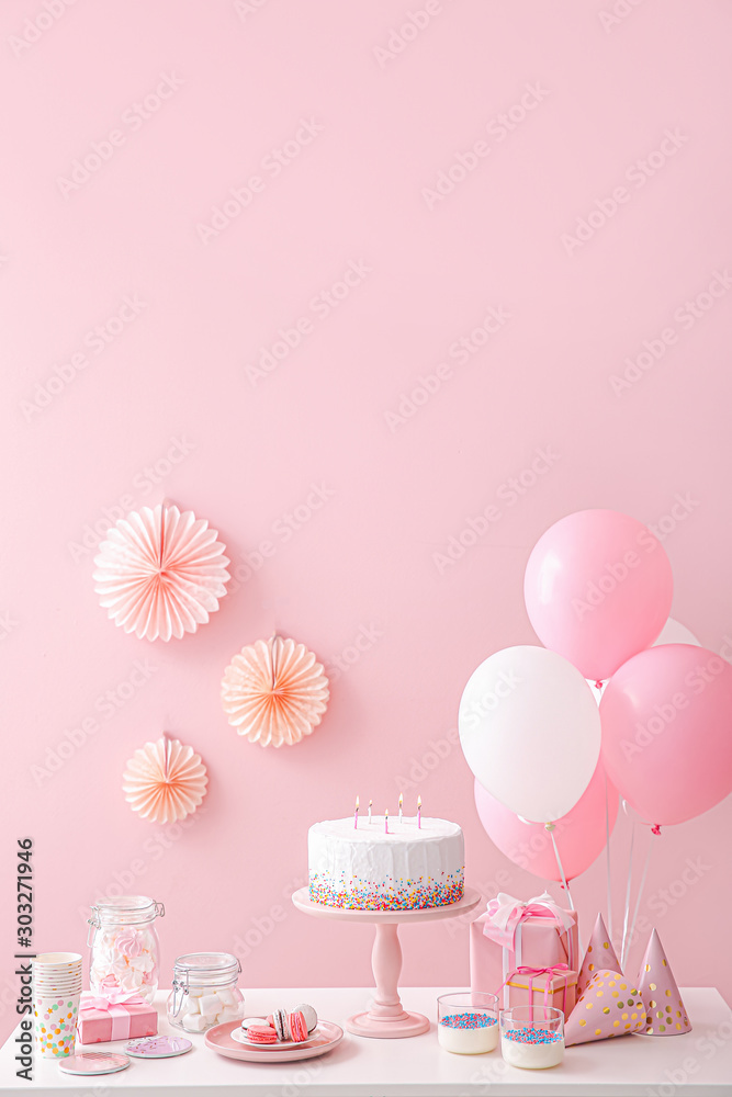 Tasty candy bar for Birthday party on table against color background