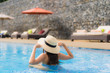 © siraphol - Beautiful portrait asian woman relax happy smile around outdoor swimming pool