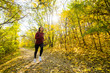 © serejkakovalev - Young happy woman runner training in sunny autumn park