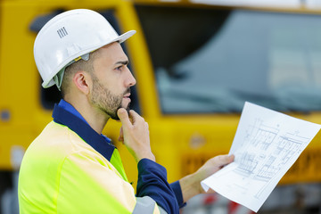 profile of pensive man in hardhat