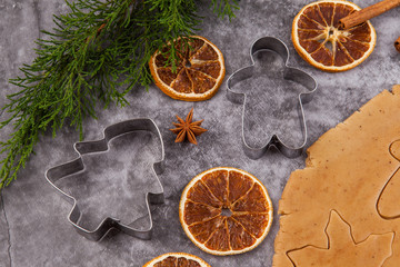 Wall Mural - cooking christmas gingerbread on grey background