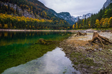 Vorderer Gosausee Lake, Upper Austria. Colorful Autumn Alpine View Of Mountain Lake With Clear Transparent Water And Reflections. Dachstein Summit And Glacier In Far.