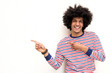 © mimagephotos - cool young arab guy with afro hair and pointing fingers to copy space on white background