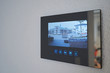 Intercom with video image mounted on the wall in the house. Close-up
