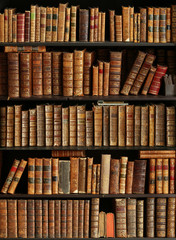 old books on wooden shelf