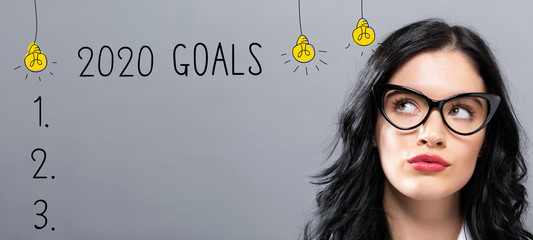 Poster - 2020 goals with young businesswoman in a thoughtful face