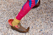 Artist's foot in a medieval jester costume