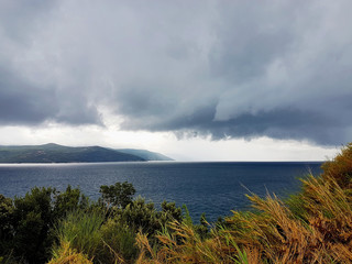 clouds over island