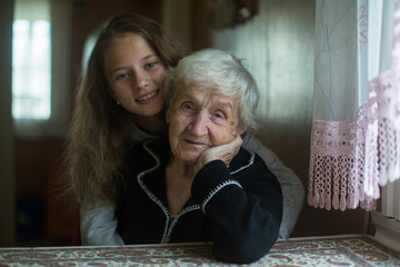 Wall Mural - Little girl with her grandmother has a tender relationship.