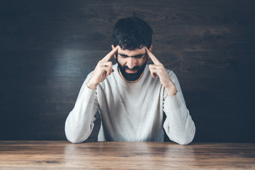 Wall Mural - .sad man hand on head on dark background