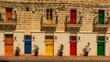 colorful doors of a building at the harbor of marsaxlokk on malta