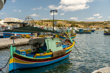 Wall Mural - view of the harbor with boats, of marsaxlokk on malta