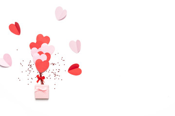 Wall Mural - Valentine's day background with red and pink hearts like balloons isolated on white background, top view