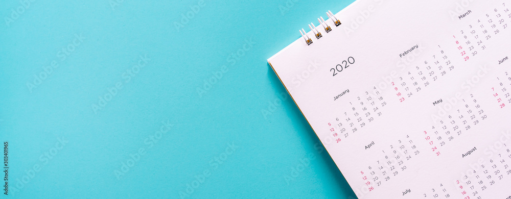close up top view on white calendar 2020  month schedule to make appointment meeting or manage timetable each day lay on blue background for planning work and life concept - obrazy, fototapety, plakaty 