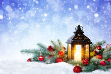 Christmas Lantern On Snow With Fir Branch And Baubles. Winter Decoration Background