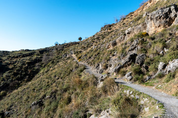 Wall Mural - A footpath going through the Sierra Nevadas in Andalucia, Spain near Granada.