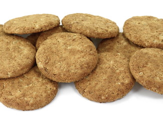 Wall Mural - Round whole wheat biscuit, cookie with raisins isolated on white background. Biscuits with whole-wheat (wholemeal) flour isolated on white background 