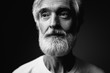 © luengo_ua - Close up studio portrait of handsome senior man with gray beard.
