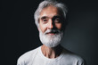 © luengo_ua - Studio portrait of handsome senior man with gray beard.