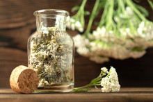 Concept Of Homeopathy And Herbal Treatment - Dried Achillea Millefolium Know As Yarrow In A Bottle