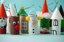 Paper Toy Santa, Snowman, Grinch For Xmas Party. Easy Crafts For Kids On Blue Background, Copy Space, Die Creative Idea From Toilet Tube Roll, Recycle Reuse Eco Concept