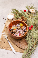 Wall Mural - Pickled (fermented) mushrooms. Traditional New Year (Christmas) snack. Festive table cutlery setting