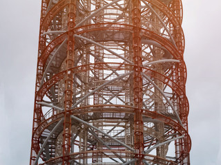 Metal openwork radar tower. Telecommunication antenna tower