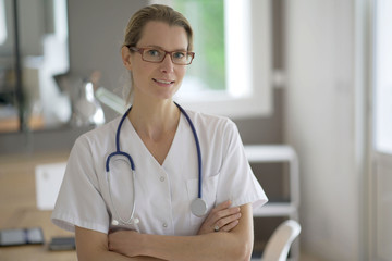 nurse facing camera in an office