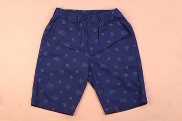 Sticker - Navy blue men casual short pants on pink pastel background