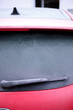 Red car. Winter is the season of cold weather, frosty patterns on glass.
