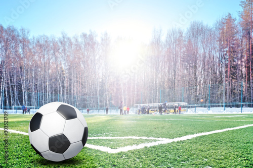 Traditional Football Ball In Corner Of Soccer Pitch Field With
