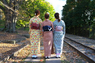 Kyoto,Japan-November 14, 2019: Ladies wearing Kimono on the rail of Incline at Keage Incline in Kyoto