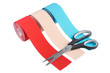three rolls kinesiology tape for athletes and scissors isolated on white background. Kinesiology taping manipulate nerve receptors and reduces pain in muscles and speeds up the healing process