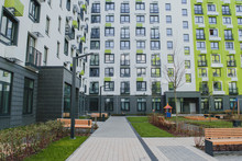 New Residential Quarter Of New Buildings: A Modern Playground In The Courtyard Of An Apartment Building With A Bright Facade 1