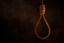 Rusty Steel Ropes Noose For Hanging With Grunge Rust Wall Background Dark Black And Dim Light