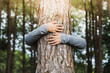 Woman hug the  tree