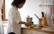 © FotoArtist - Black skin women prepare cooking dinner in kitchen