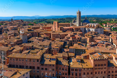 View of Siena Cathedral (Duomo di Siena) in Siena, Italy. Skyline of Siena.