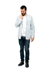 Wall Mural - Full-length shot of Handsome man with beard with toothache over isolated white background