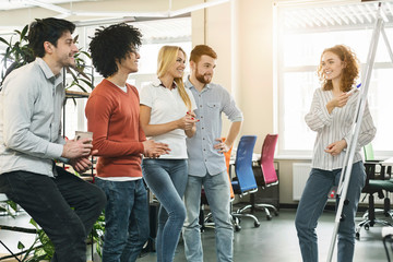 Poster - Female team leader making presentation for colleagues in office