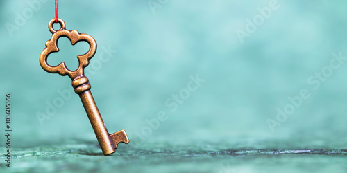 Cuadros en Lienzo Real estate, buy home honcept, gold key on a blue background, web banner with co