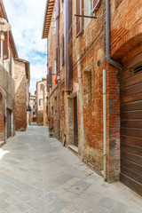 Canvas Print - Alley in a back street in a village