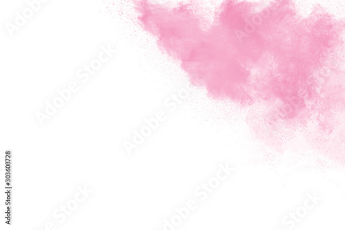 Pink powder explosion on white background.Pink dust splatter  on background.