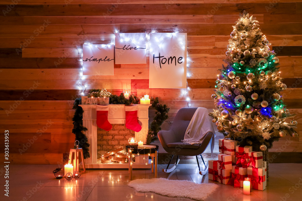 Interior of room with beautiful decorated Christmas tree at night