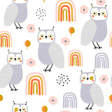 Seamless pattern with owls and rainbows. Creative holiday texture. Great for fabric, textile Vector Illustration