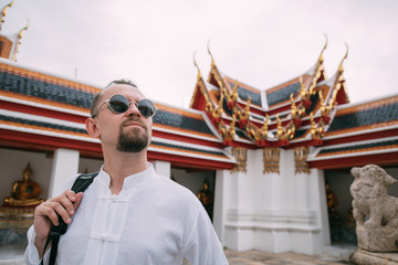 Male tourist in a Buddhist temple.