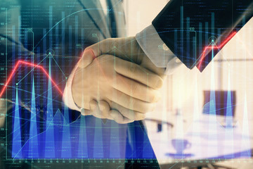 Multi exposure of financial graph on office background with two businessmen handshake. Concept of success in business