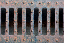 Sewer Manhole Drain On The Urban Road Texture.