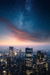 Dramatic cityscape with epic clouds and the stars of the milky way