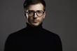 © blackday - Young smart man wearing glasses and a folded polo neck